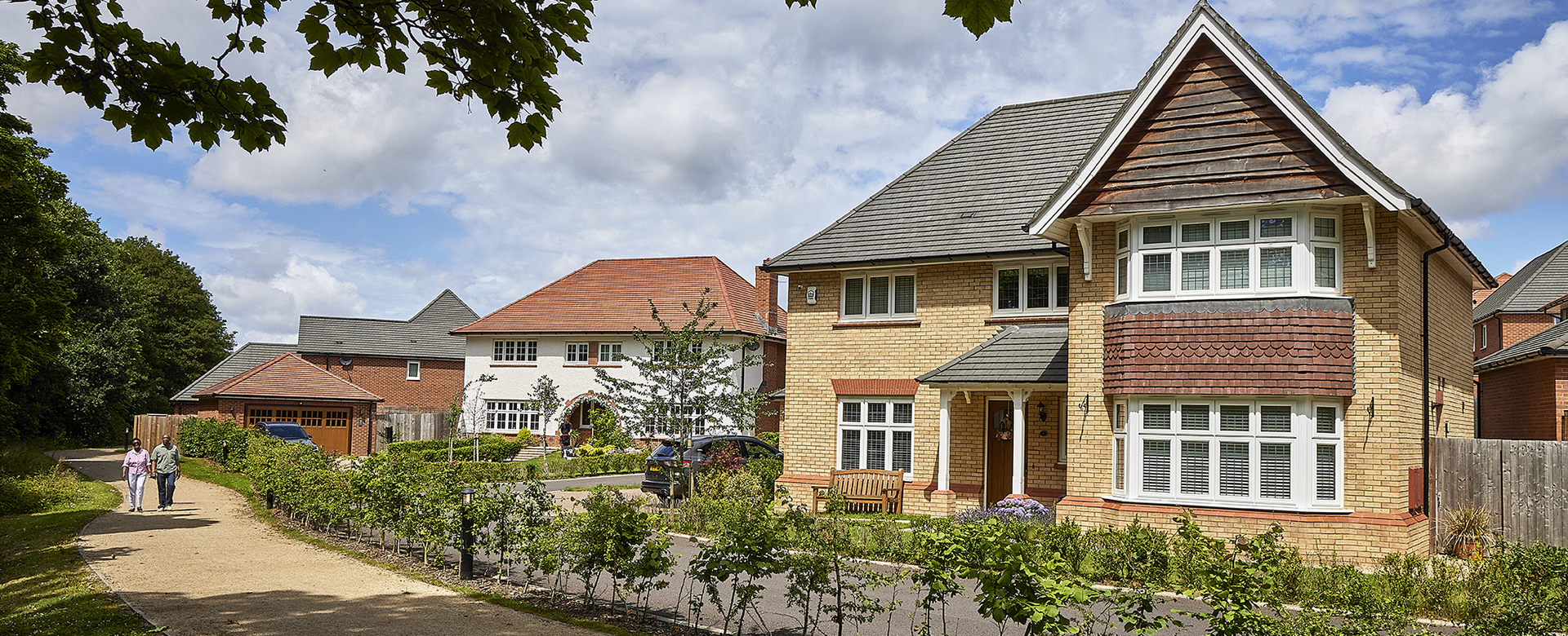 4 - Redrow - Couple walk by Allerton Gardens