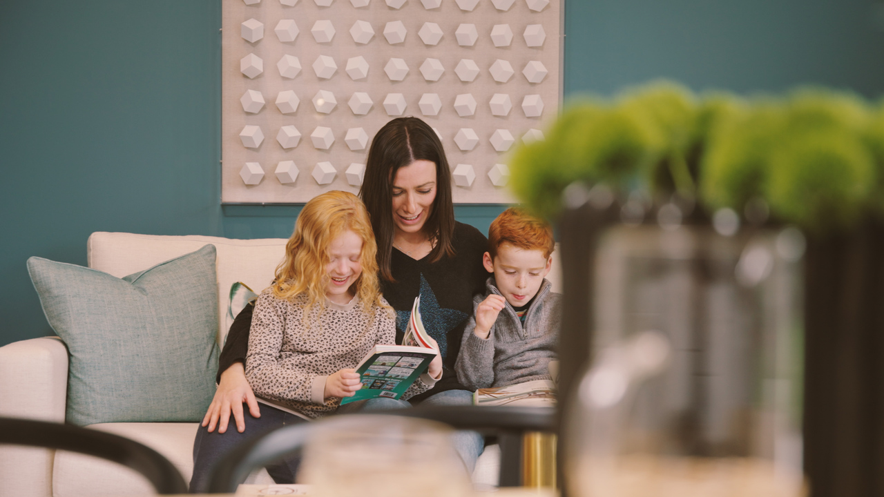 Redrow - Inspiration - Woman reading with two children