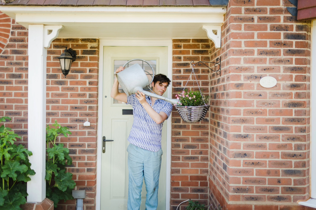 Redrow - Inspiration - Man watering flowers