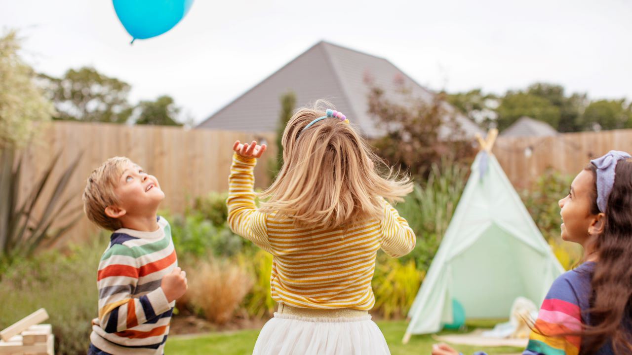 Redrow - Inspiration - Children playing in Redrow home garden