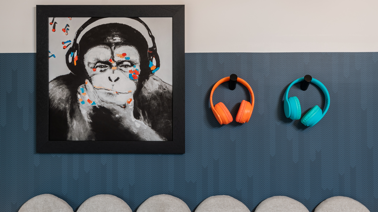 Redrow - Inspiration - Picture of monkey wearing headphones and 2 pairs of headphones on the wall