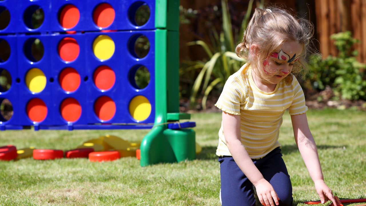Redrow - Inspiration - Little girl playing with outdoor games