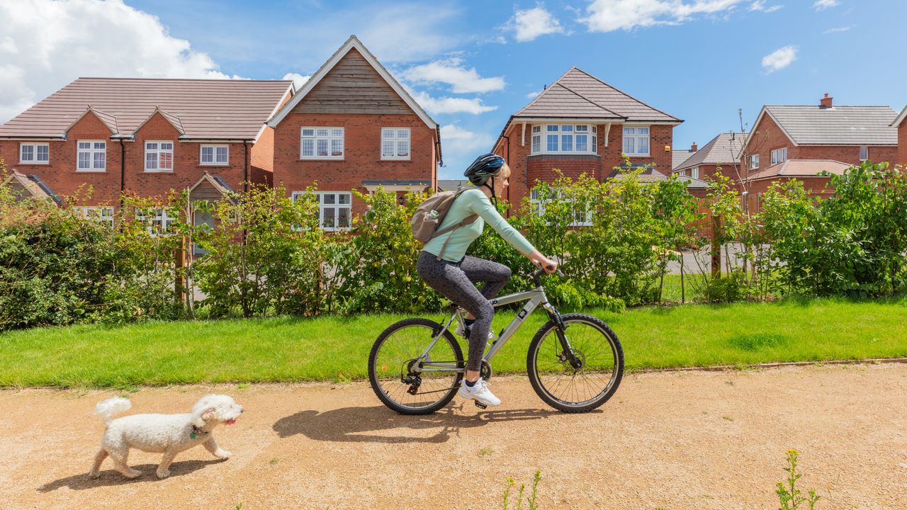 Redrow - Inspiration - Women cycling on Redrow Development