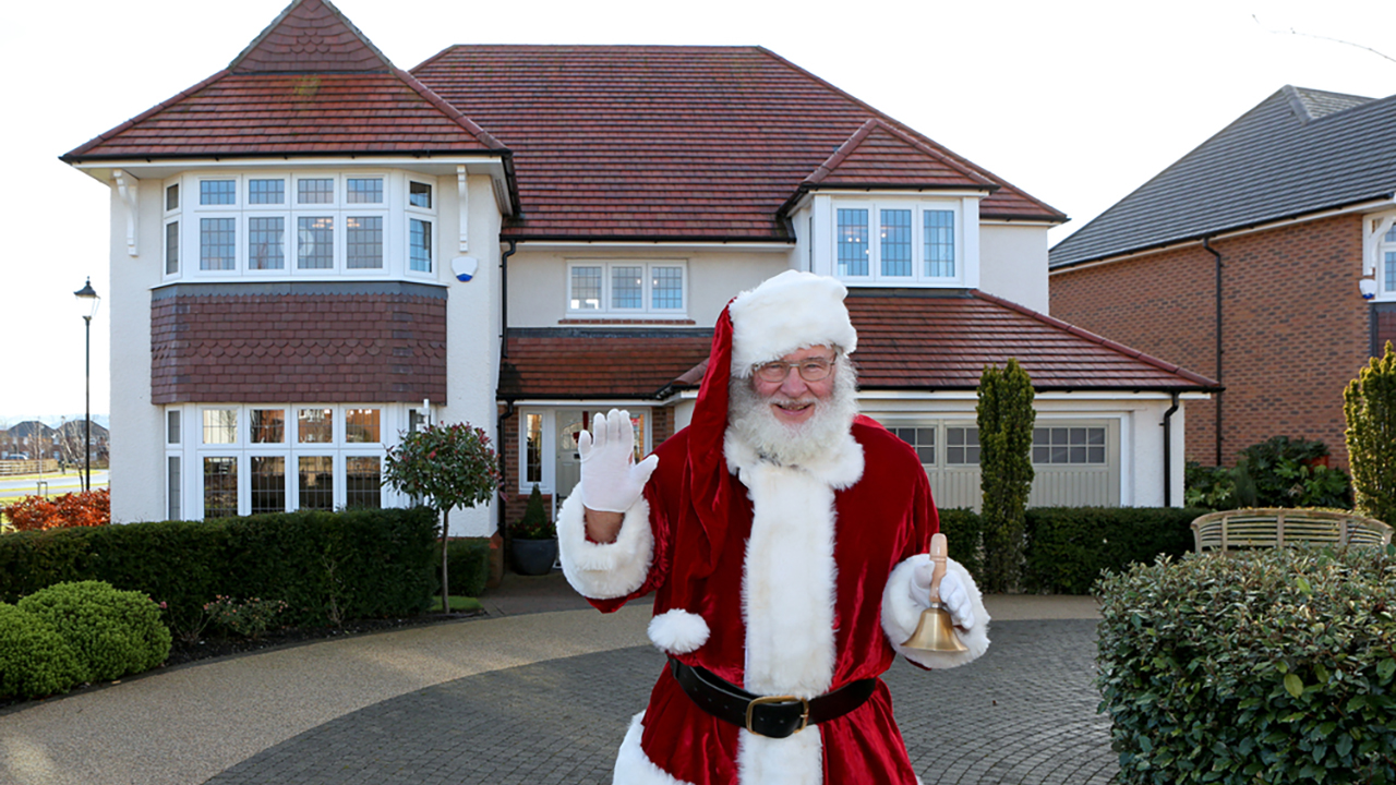 Redrow - News - Santa Meet and Greet Event - Father Christmas waving