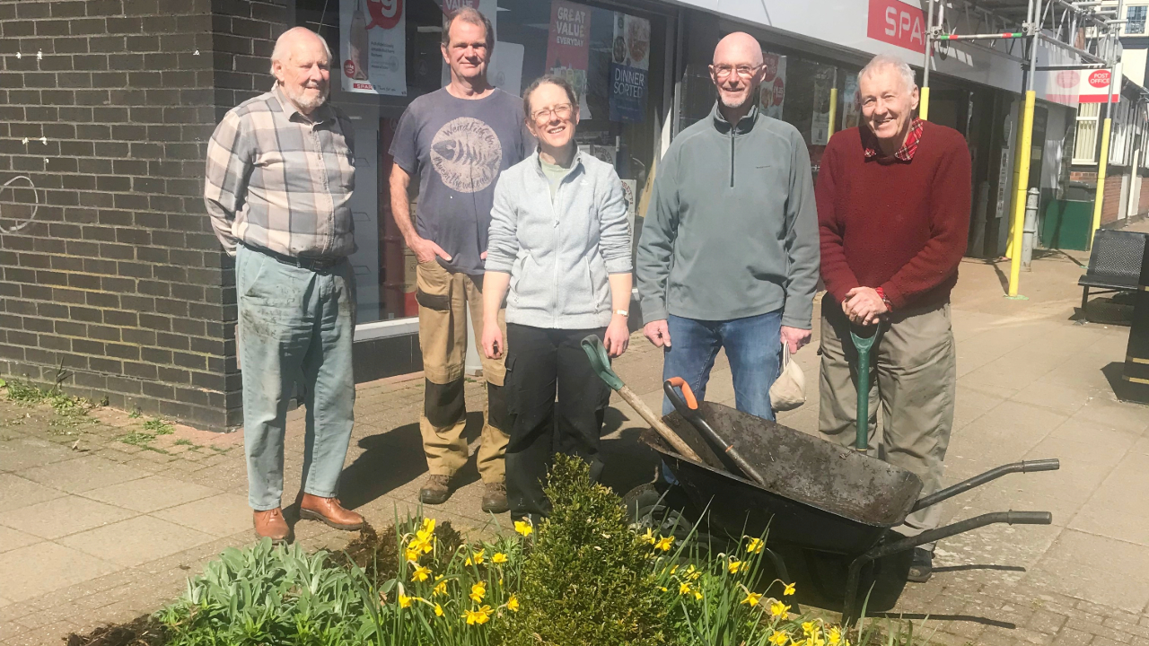 Redrow - News - Volunteers planting flowers around the village