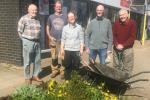 Redrow - News - Volunteers planting flowers around the village