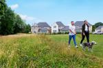 Redrow - News - Couple walking a dog