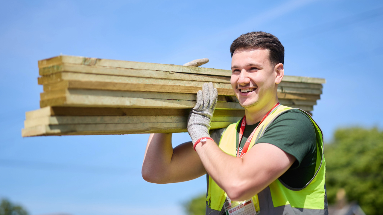 Redrow - News - Sam carrying wooden planks