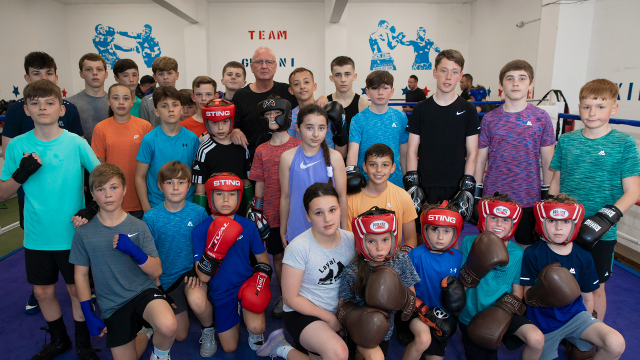 Redrow - News -  Boxing coach John Rice with club members